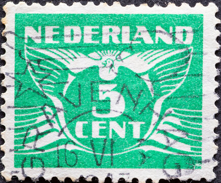 Netherlands - circa 1941: a postage stamp from the Netherlands, showing a stylized graphic. Flying Dove with a number 5 cent green