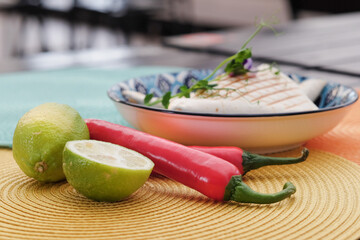 Traditional mexican food on the street.close up. Microgreens, pepper and lime on the table . High quality photo
