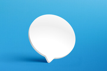 Empty white speech bubble on blue background