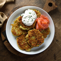 Homemade potato pancakes or lakes with salmon