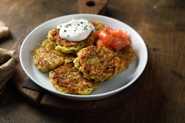 Homemade potato pancakes or lakes with salmon