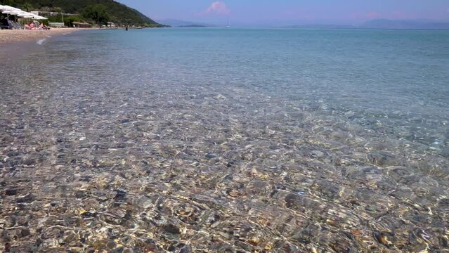 Ionian Sea, view from beach in Moraitika large village, Corfu Island in Greece