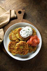 Homemade potato pancakes or lakes with salmon