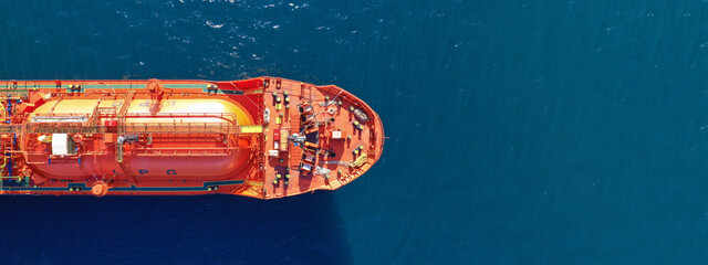 Aerial drone ultra wide top down photo of industrial LPG gas tanker ship anchored in deep blue sea - obrazy, fototapety, plakaty