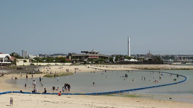 CHATAN-CHO, OKINAWA, JAPAN - AUGUST 2021 : View of Chatan sunset beach (Ocean or sea). Wide view, time lapse shot in daytime. Summer holiday, vacation and resort concept video.