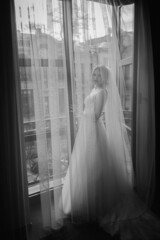 A girl in a wedding dress, a bride with flowers, delicate details.