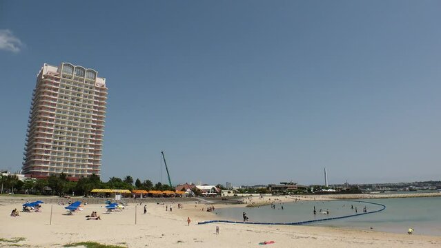 CHATAN-CHO, OKINAWA, JAPAN - AUGUST 2021 : View of Chatan sunset beach (Ocean or sea) in daytime. Summer holiday, vacation and resort concept video.