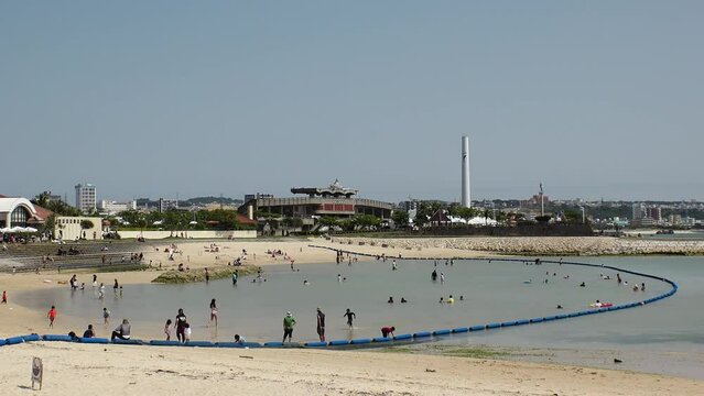 CHATAN-CHO, OKINAWA, JAPAN - AUGUST 2021 : View of Chatan sunset beach (Ocean or sea). Wide view, time lapse shot in daytime. Summer holiday, vacation and resort concept video.