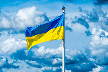 Flag of Ukraine against the background of a cloudy sky