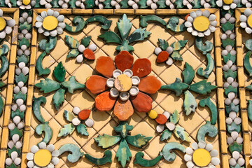 Golden Pattern at Wat Pho in Bangkok, Thailand with Floral Design of shapes and color. Vintage thai golden pattern with gems. Asian golden ornament in Thailand. Traditional decorative background