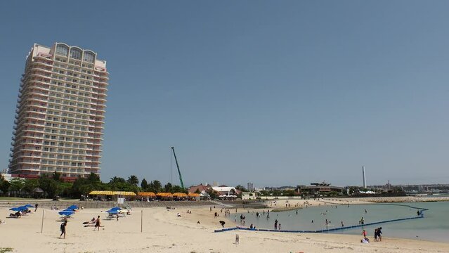 CHATAN-CHO, OKINAWA, JAPAN - AUGUST 2021 : View of Chatan sunset beach (Ocean or sea). Wide view, time lapse shot in daytime. Summer holiday, vacation and resort concept video.