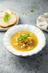 Traditional pea soup with smoked bacon