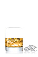 Whiskey glass with ice cubes isolated on white background with clipping path and copy space for your text