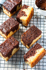 Chocolate marble cake. Slices on tray and wooden table