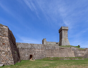 Part of Raficofani fortress building with exit and Tower, Tuscany, Italy