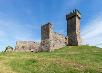 Fototapeta na wymiar Well preserved Rocca of Radicofani and part of the fortress on a summer day. Tuscany, Italy