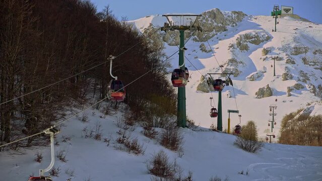Panoramic cabins transport skiers to the ski slopes. Pallottieri cable car. Aremogna skyresort, Roccaraso, province of L'Aquila, Abruzzo, Italy