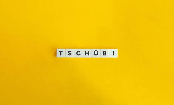 Tschüss Word on Letter Tiles on Yellow Background. Minimal Aesthetics.