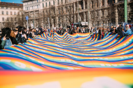 Hundreds of pacifist antiwar people holding peace flag