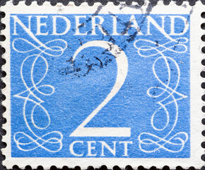 Netherlands - circa 1946: a postage stamp from the Netherlands , showing a numeral framed with...
