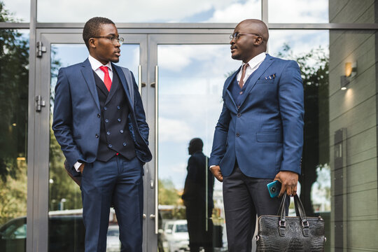 Meeting Of Two Long-time Friends Of Black African American Businessman In Suits Outdoors