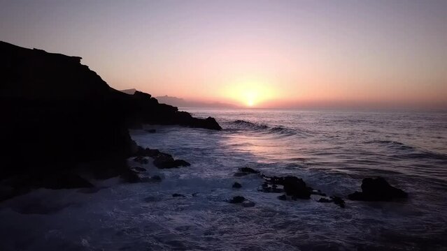 Flying above the sea coast at Sunset in Canary Islands - Fuerteventura