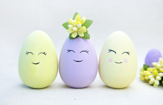 Minimal creative concept of a happy Easter.Easter eggs with painted smiley faces.