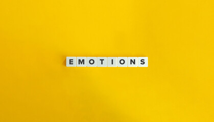 Emotions Word on Letter Tiles on Yellow Background. Minimal Aesthetics.