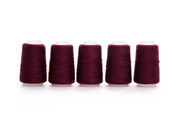 Red spool of thread isolated on white background. Skein of woolen threads. Yarn for knitting....