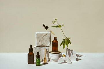 CBD oil, cannabis setting in different bottles and marijuana leaf, cannabis in a still life on...