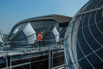 Engineer under checking the industry cooling tower air conditioner is water cooling tower air...