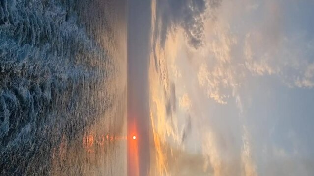 Beautiful mediterranean sunset. Orange, red shades. Vertical video