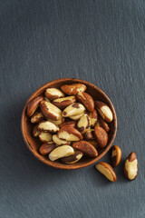 Tasty brasil nuts on gray slate background, most renowned for their high selenium content