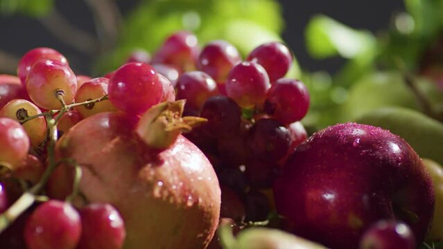 Grapes falling on fruits. Juicy fruit assortment Freshness. Close up