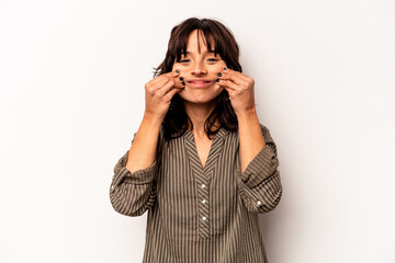 Young hispanic woman isolated on white background doubting between two options.