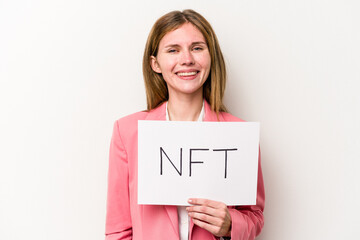 Young English woman holding a NFT placard isolated on white background happy, smiling and cheerful.