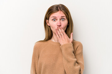 Young russian woman isolated on white background shocked, covering mouth with hands, anxious to discover something new.