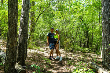 Obraz premium A man with a girl in the forest near the cave town of Tepe-Kermen Crimea Russia 2021
