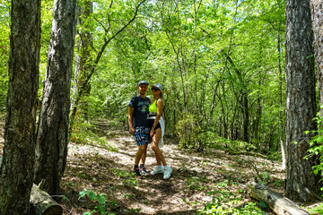 Obraz premium A man with a girl in the forest near the cave town of Tepe-Kermen Crimea Russia 2021
