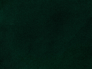 Dark green old velvet fabric texture used as background. Empty green fabric background of soft and...