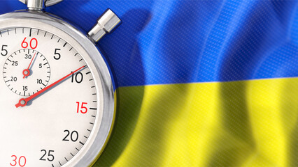Stoppuhr liegt auf Ukraine-Fahne