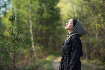 girl woman walking in nature park forest and breathing fresh air. concept of breathing, inhaling,...