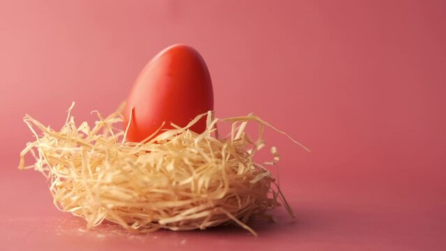 easter concept with red color egg on a red background 