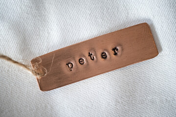 Peter identity engraved name dog tag copper metal name plate badge. Shiny and clean stamped letters...