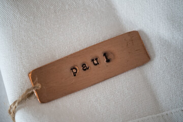 Paul identity engraved name dog tag copper metal name plate badge. Shiny and clean stamped letters on retro trinket pendent.