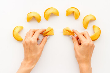 Chinese fortune cookies in hands. Asian New Year background