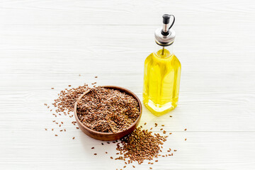 Sesame cooking oil in bottle with seeds. Cooking oil background