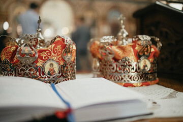 Fototapeta na wymiar Pair of golden crowns n the church. Orthodox religious crowns.