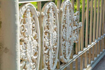 Historical vintage white cast iron lattice fence, ellipse decorative ornamets