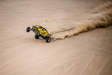 Rolgordijnen Doha,Qatar,February 23, 2018: Off road buggy car in the sand dunes of the Qatari desert. © A1